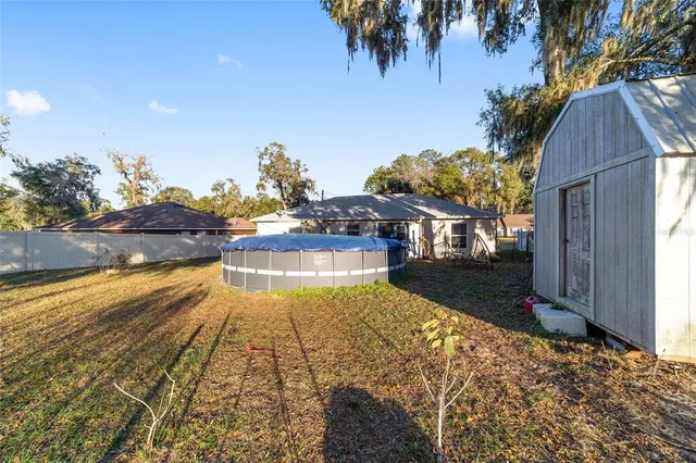 a view of residential houses with yard and mountain view