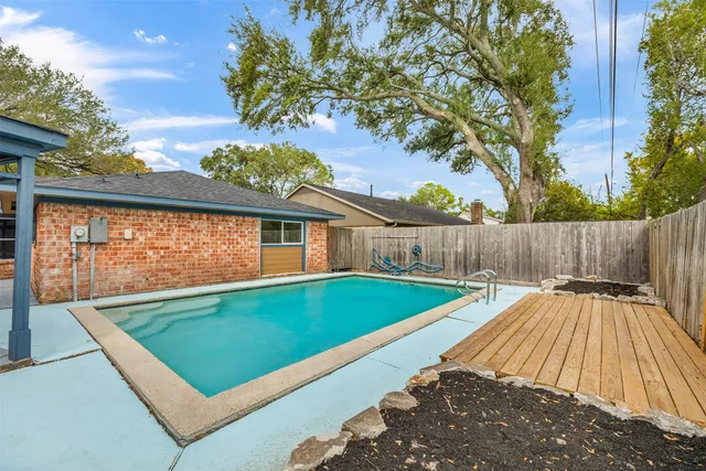 a view of swimming pool with seating area