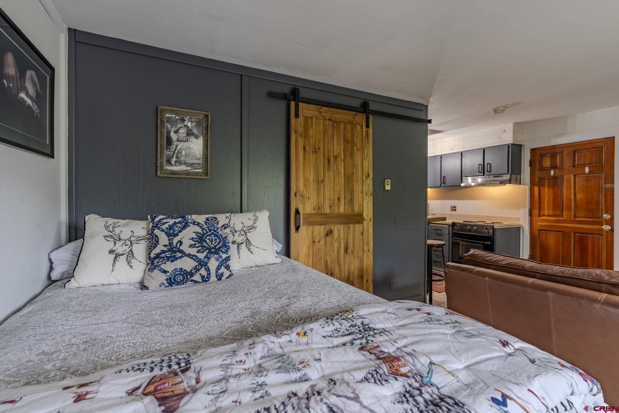 395 Sheol Street, Unit 109 Durango, CO 81301 - Photo 14 of 30 a large bed sitting in a bedroom next to a window