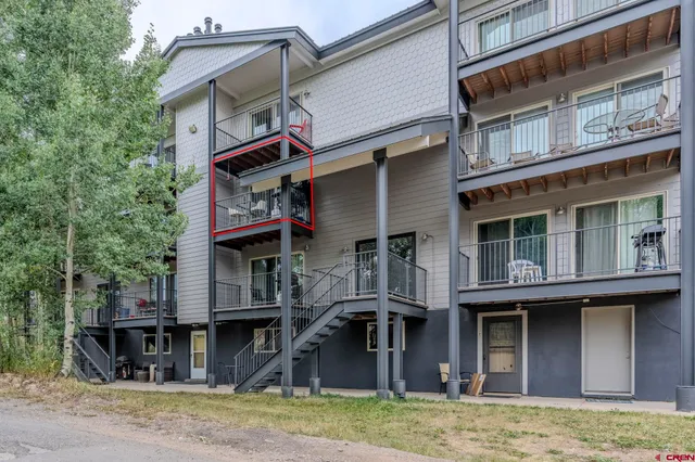 a front view of a house with parking area