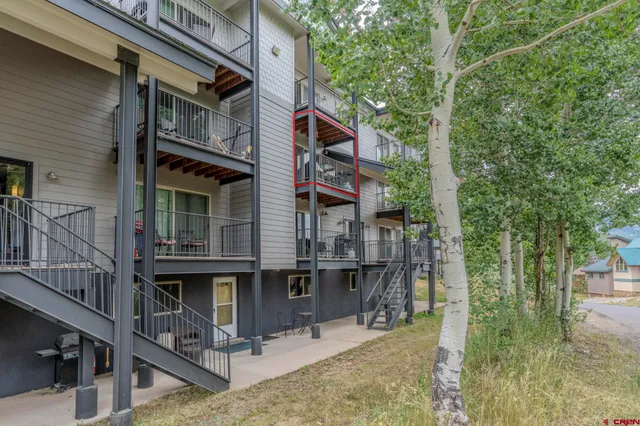 a view of a house with a mountain in the background