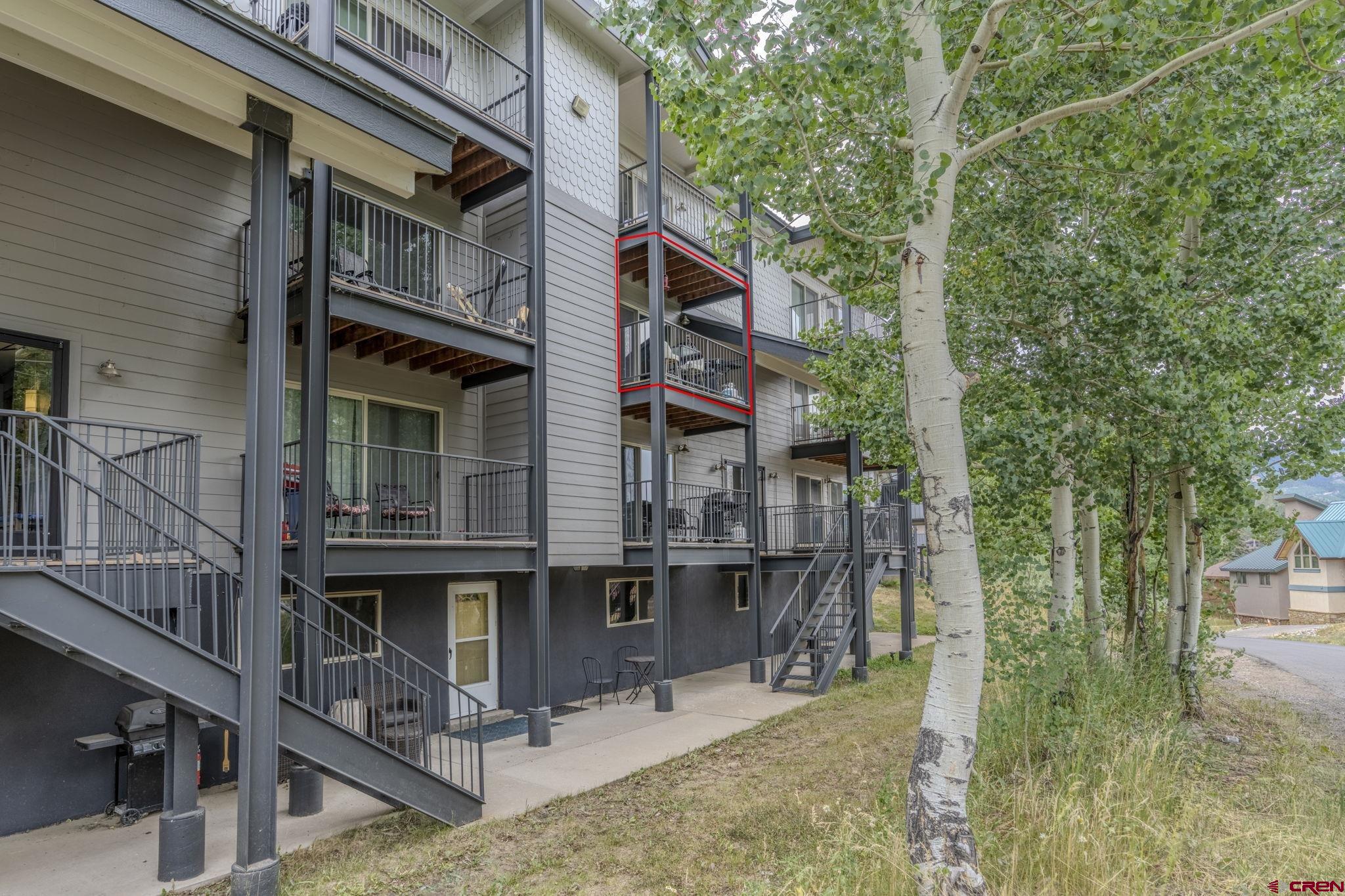 395 Sheol Street, Unit 109 Durango, CO 81301 - Photo 20 of 30 a front view of a house with parking area