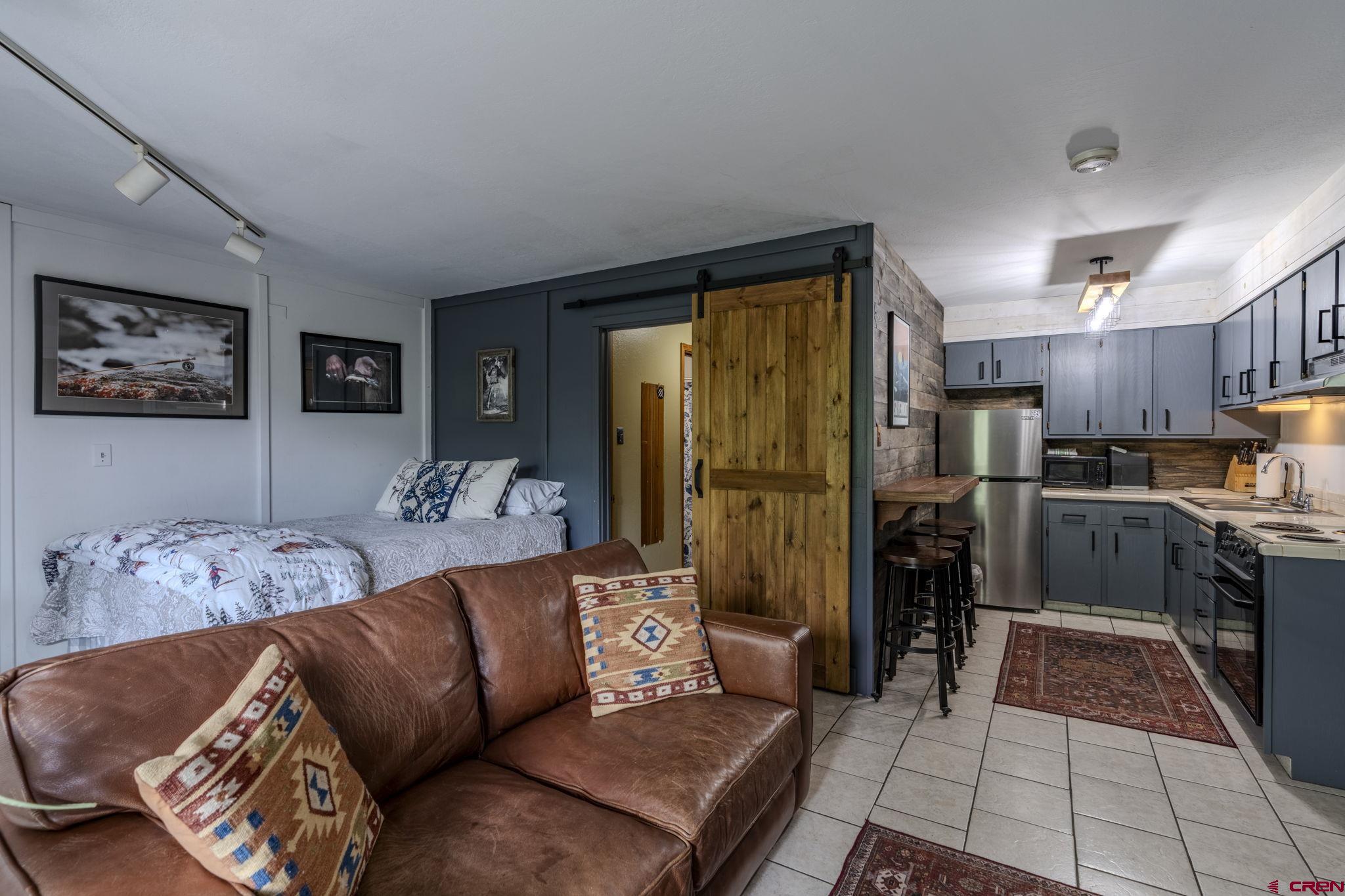395 Sheol Street, Unit 109 Durango, CO 81301 - Photo 6 of 30 a living room with furniture and kitchen view