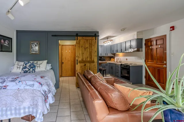 a bedroom with bed furniture and a window