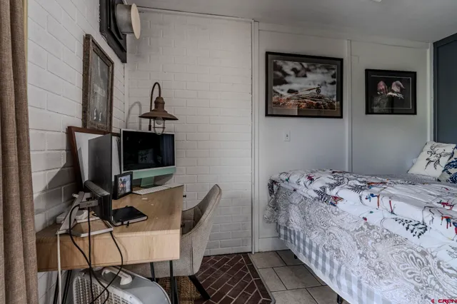 a bedroom with a bed and furniture