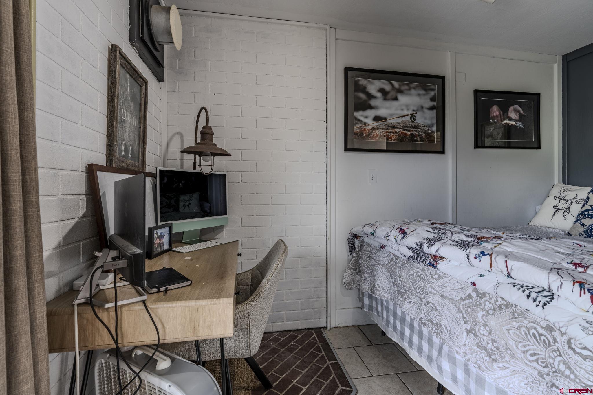 395 Sheol Street, Unit 109 Durango, CO 81301 - Photo 8 of 30 a bedroom with a bed and furniture