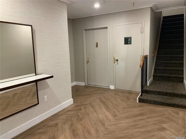 a room with pool table and windows