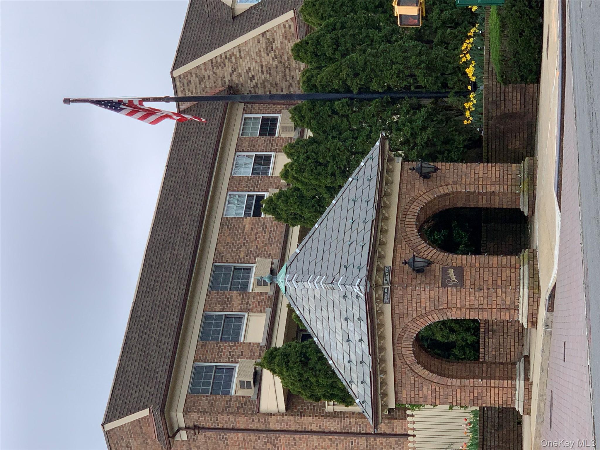 1338 Robin Lane, Unit 1212 Queens, NY 11360 - Photo 12 of 22 a front view of a house with yard