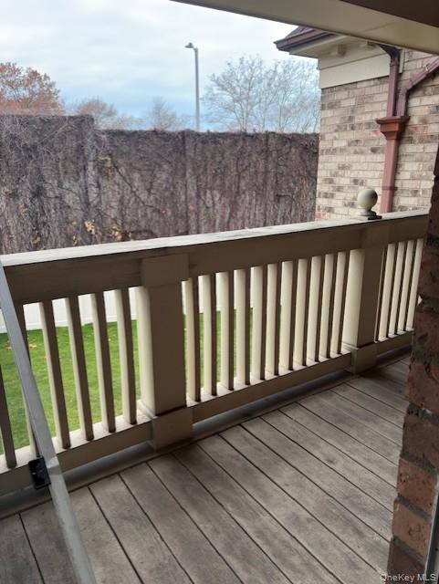 1338 Robin Lane, Unit 1212 Queens, NY 11360 - Photo 18 of 22 a view of a balcony with wooden floor