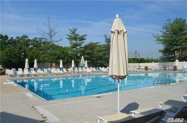 1338 Robin Lane, Unit 1212 Queens, NY 11360 - Photo 2 of 22 a view of a park with large trees and entertaining space