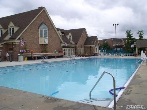 1338 Robin Lane, Unit 1212 Queens, NY 11360 - Photo 8 of 22 a aerial view of a house with a yard