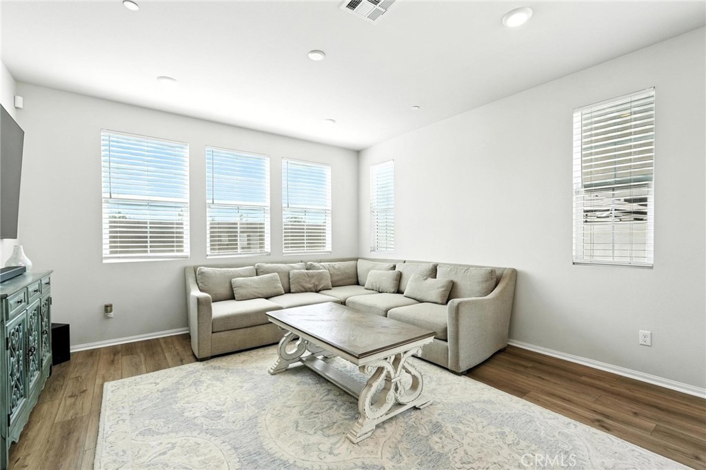 28267 Ashtree Street Temecula, CA 92591 - Photo 18 of 41 a living room with furniture and a large window