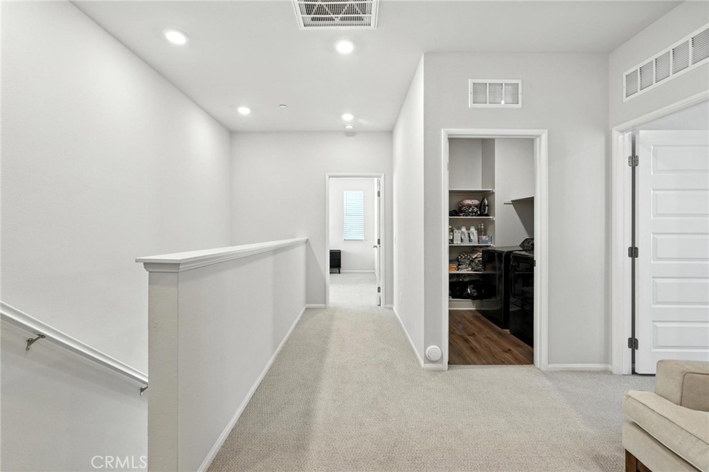 28267 Ashtree Street Temecula, CA 92591 - Photo 19 of 41 a view of hallway with wooden floor