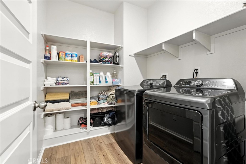 28267 Ashtree Street Temecula, CA 92591 - Photo 21 of 41 a room with furniture and a wooden floor