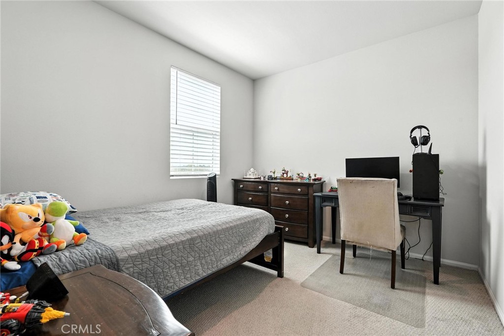 28267 Ashtree Street Temecula, CA 92591 - Photo 22 of 41 a bedroom with a bed and a window