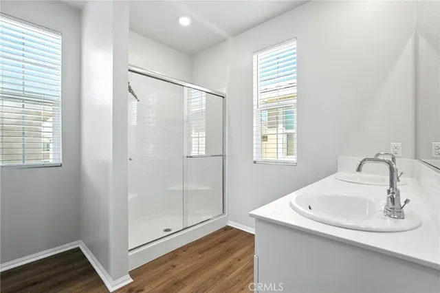 a bathroom with a sink and shower