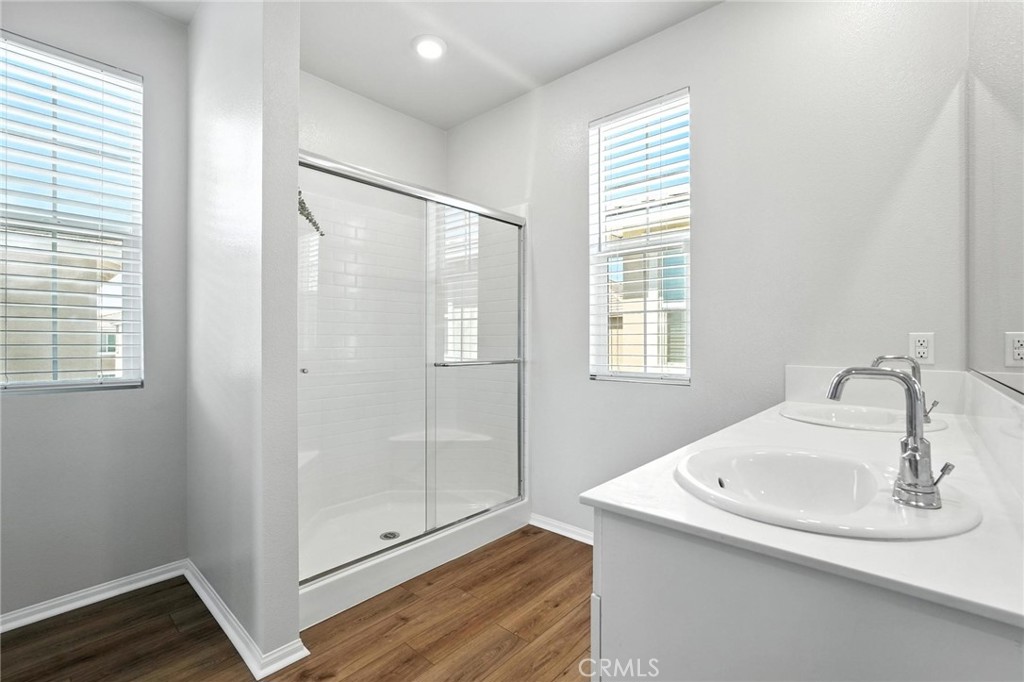 28267 Ashtree Street Temecula, CA 92591 - Photo 28 of 41 a bathroom with a sink and shower