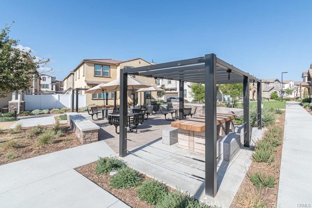 28267 Ashtree Street Temecula, CA 92591 - Photo 32 of 41 a view of a patio with a table and chairs