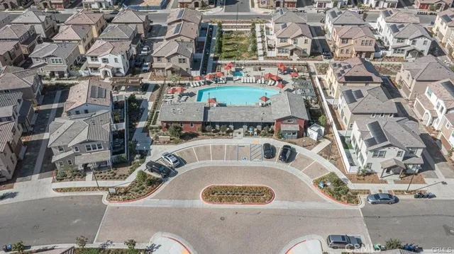 an aerial view of residential houses with city view