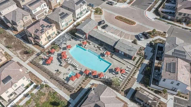 a view of a patio with dining table and chairs