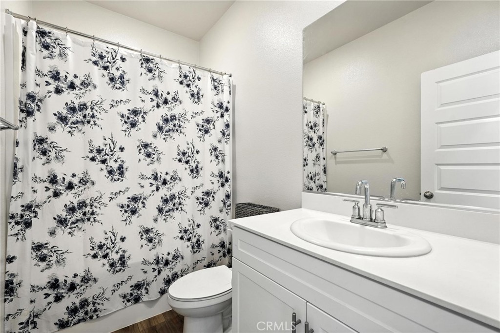 28267 Ashtree Street Temecula, CA 92591 - Photo 6 of 41 a bathroom with a sink toilet and a mirror