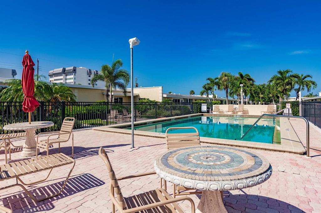 6006 Midnight Pass Road, Unit 24 Sarasota, FL 34242 - Photo 10 of 16 a view of a patio with swimming pool