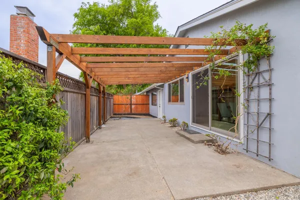 a view of a house with a backyard and garden