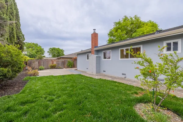 a house view with a backyard space
