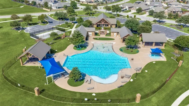 an aerial view of a house with outdoor space