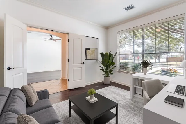 a living room with furniture and a large window