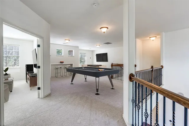 a view of hall way with furniture