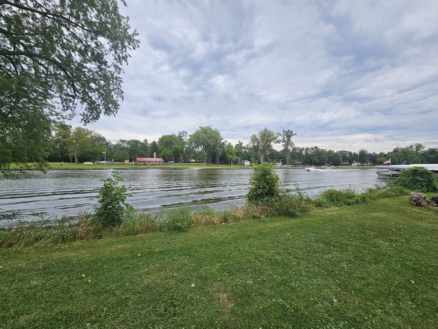 452 Mildred Avenue Cary, IL 60013 - Photo 20 of 20 a view of a lake with houses in the background