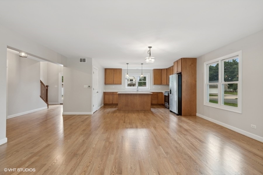 452 Mildred Avenue Cary, IL 60013 - Photo 4 of 20 a view of a kitchen with wooden floor and electronic appliances