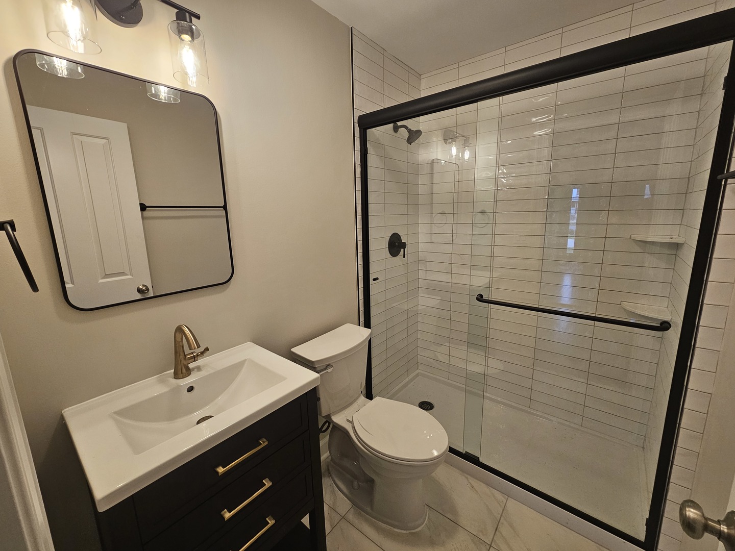 452 Mildred Avenue Cary, IL 60013 - Photo 9 of 20 a bathroom with a sink toilet and shower