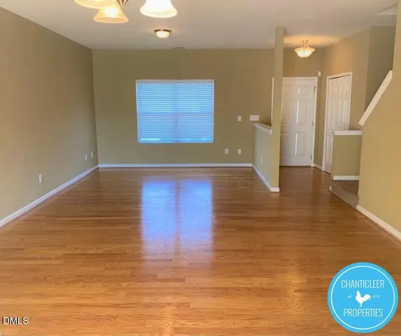 a view of a livingroom with wooden floor