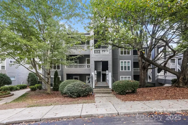 a front view of a building with garden