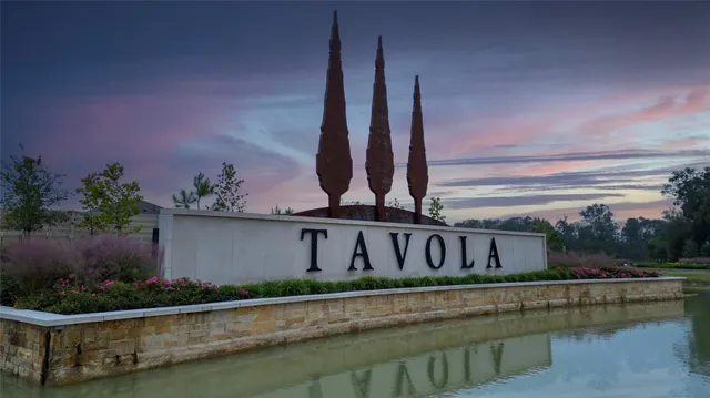 a front view of a house with garden and swimming pool