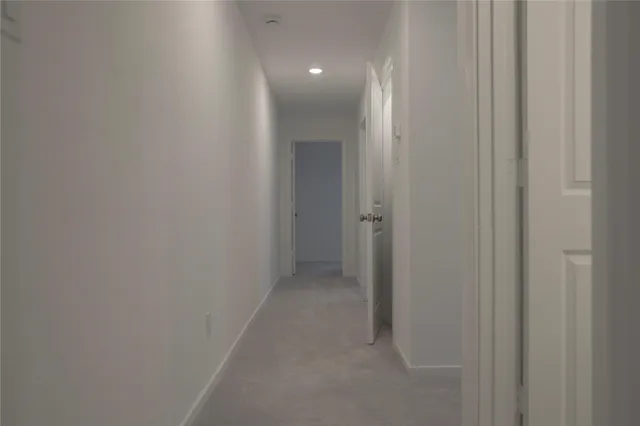 a view of a hallway with closet