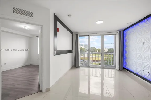 a view of an empty room and window