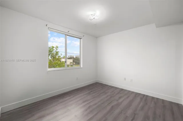 a bathroom with a toilet a sink a mirror and a bathtub