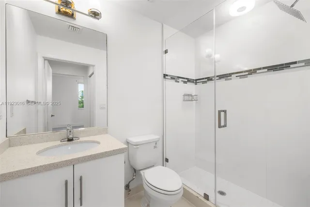 a bathroom with a toilet and a sink