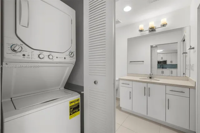 a bathroom with a toilet sink vanity and mirror