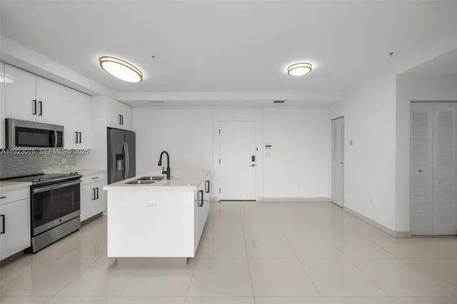 a view of a kitchen with stove and microwave