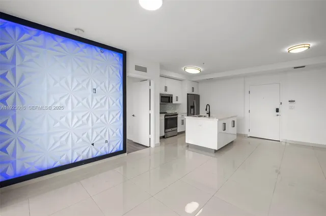a view of kitchen with refrigerator and window