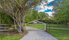 11165 Southwest Meadowlark Circle Stuart, FL 34997 - Photo 2 of 21 GATED ENTRANCE