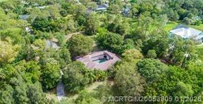 11165 Southwest Meadowlark Circle Stuart, FL 34997 - Photo 21 of 21 DRONE VIEW OF PROPERTY AND HOUSE