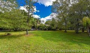 11165 Southwest Meadowlark Circle Stuart, FL 34997 - Photo 4 of 21 SURROUNDED BY TROPICAL FOLIAGE...NATURAL AND BEAUTIFUL