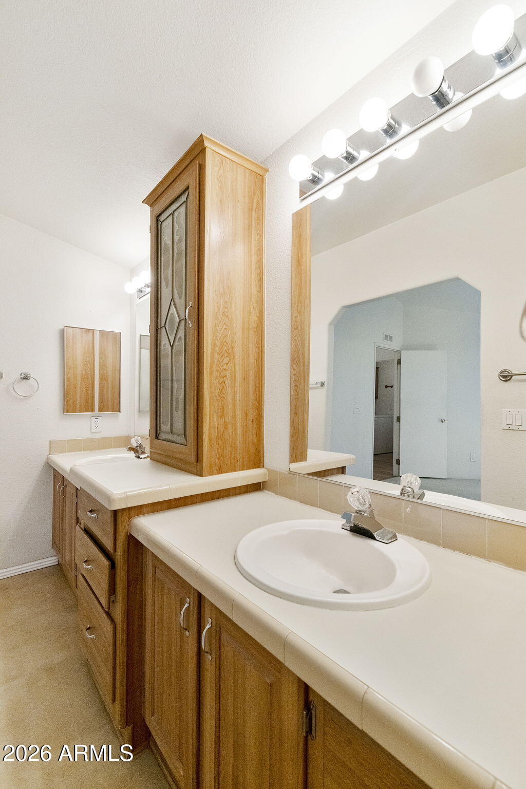 3700 South Tomahawk Road, Unit 73 Apache Junction, AZ 85119 - Photo 17 of 49 a bathroom with a sink and a mirror