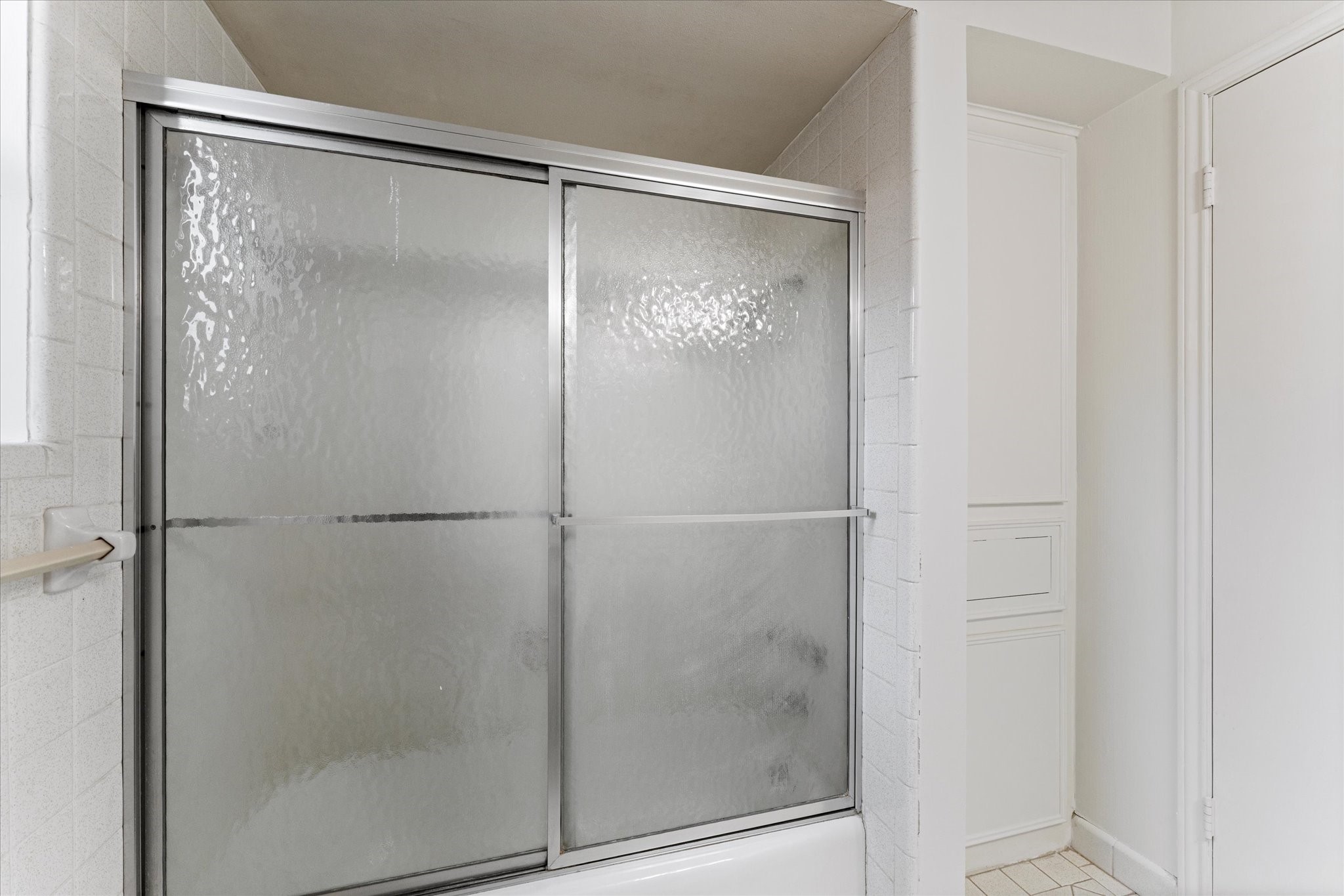 983 West Donovan Street Houston, TX 77091 - Photo 35 of 46 Guest bath shower and storage freshly painted