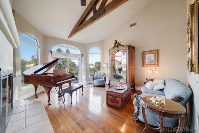 a kitchen with stainless steel appliances granite countertop a sink a stove and a wooden floors